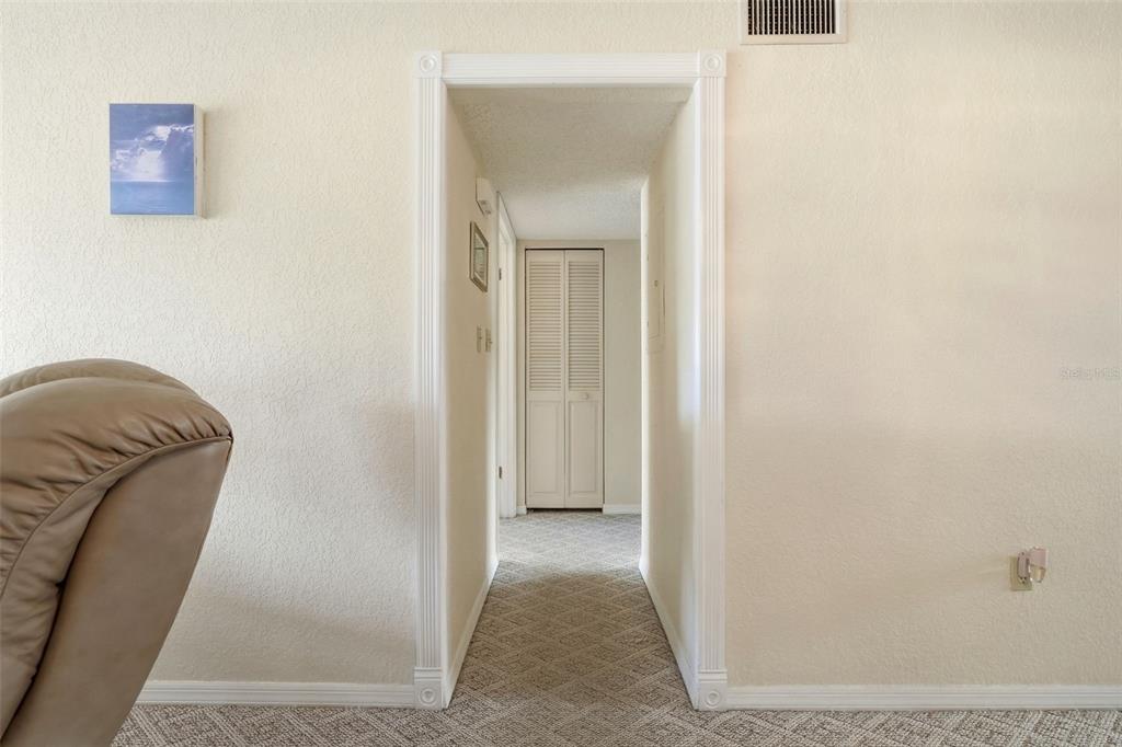 110 North Tremain Street, Unit 109 Mount Dora, FL 32757 - Photo 30 of 45 a view of a hallway with a couch