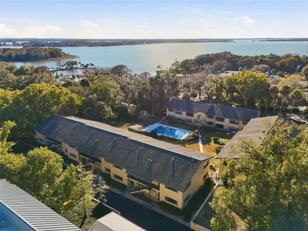 an aerial view of a house with a yard