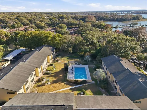 an aerial view of a house with a swimming pool