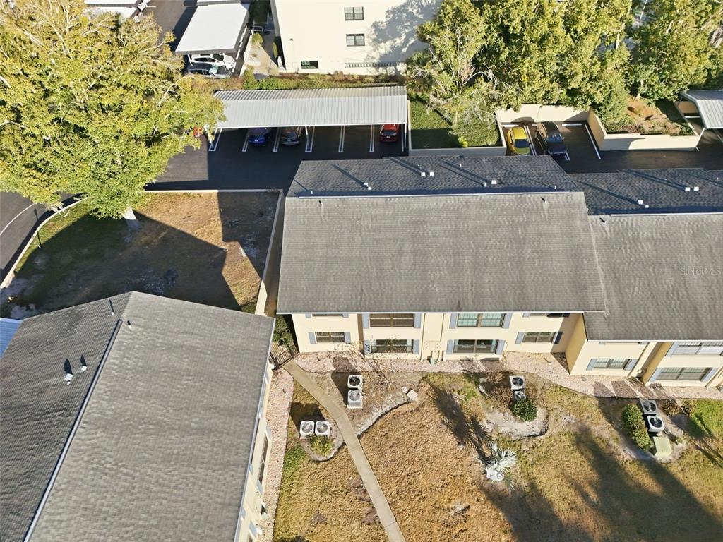 110 North Tremain Street, Unit 109 Mount Dora, FL 32757 - Photo 36 of 45 an aerial view of a house with a yard