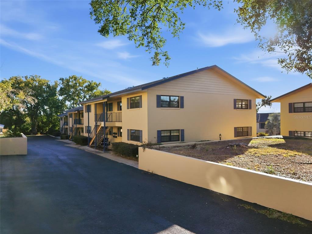 110 North Tremain Street, Unit 109 Mount Dora, FL 32757 - Photo 38 of 45 a view of a house with a patio