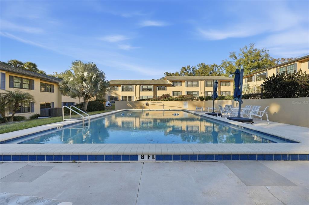 110 North Tremain Street, Unit 109 Mount Dora, FL 32757 - Photo 43 of 45 a view of a swimming pool with a patio