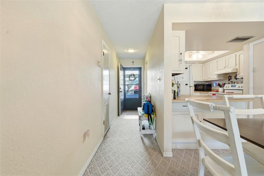 110 North Tremain Street, Unit 109 Mount Dora, FL 32757 - Photo 10 of 45 a view of kitchen with furniture and refrigerator