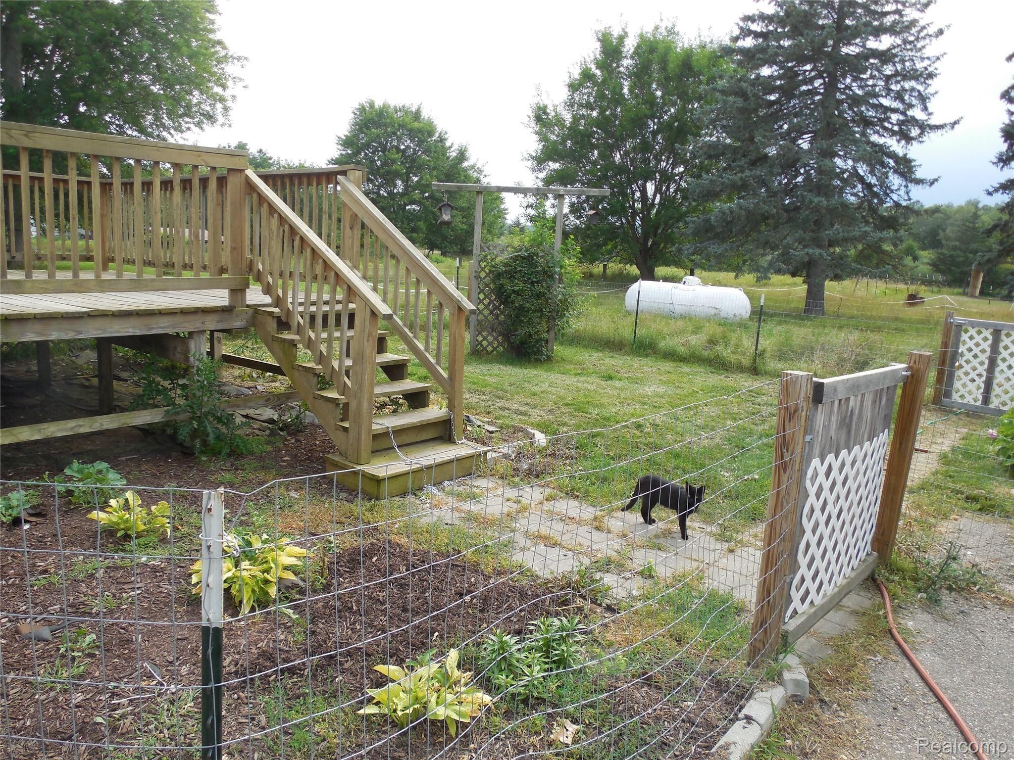 6742 Draper Road Jackson, MI 49201 - Photo 14 of 44 Fenced area off of back deck for your children or small animals!