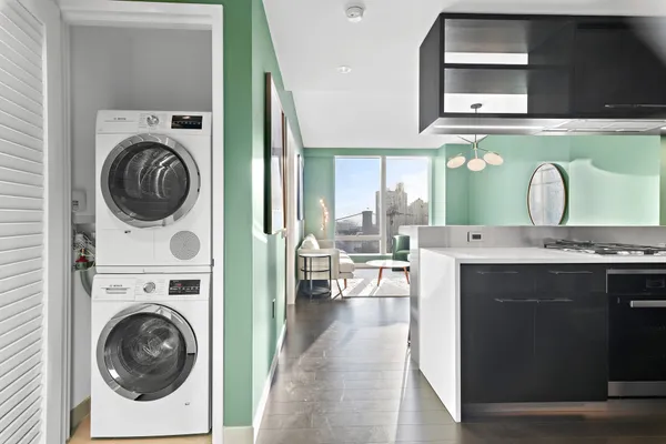 a view of a kitchen with washer and dryer
