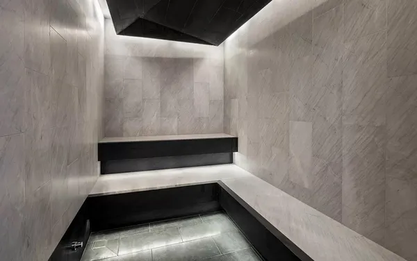 a view of a balcony with two windows and a ceiling fan