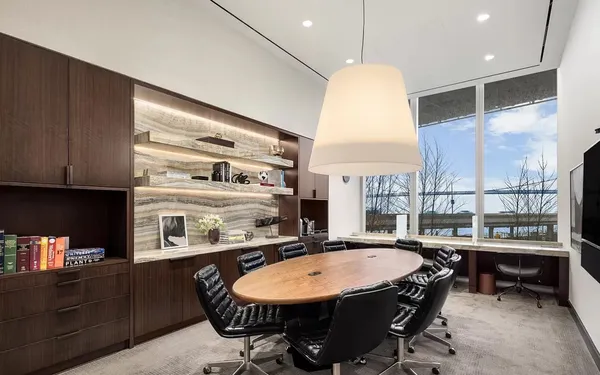 a view of a swimming pool with an outdoor seating and a window