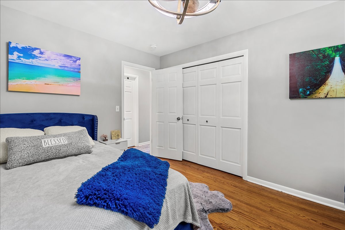 30 South Wulff Street Cary, IL 60013 - Photo 15 of 39 a bedroom with a bed and a painting on the wall