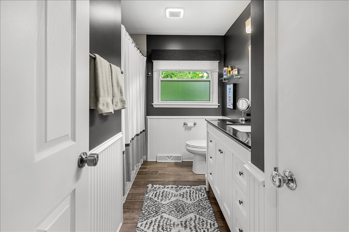 30 South Wulff Street Cary, IL 60013 - Photo 19 of 39 a bathroom with a granite countertop sink toilet and shower