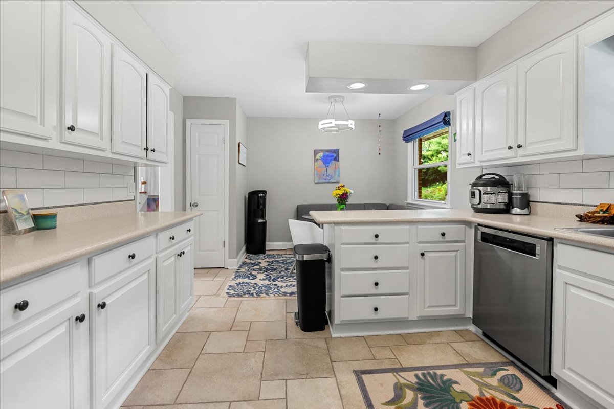 30 South Wulff Street Cary, IL 60013 - Photo 3 of 39 a kitchen with white cabinets and appliances