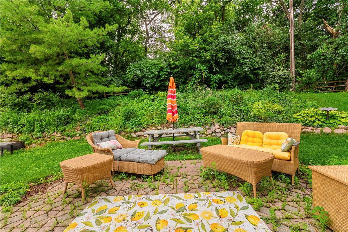 30 South Wulff Street Cary, IL 60013 - Photo 32 of 39 a backyard of a house with fountain table and chairs