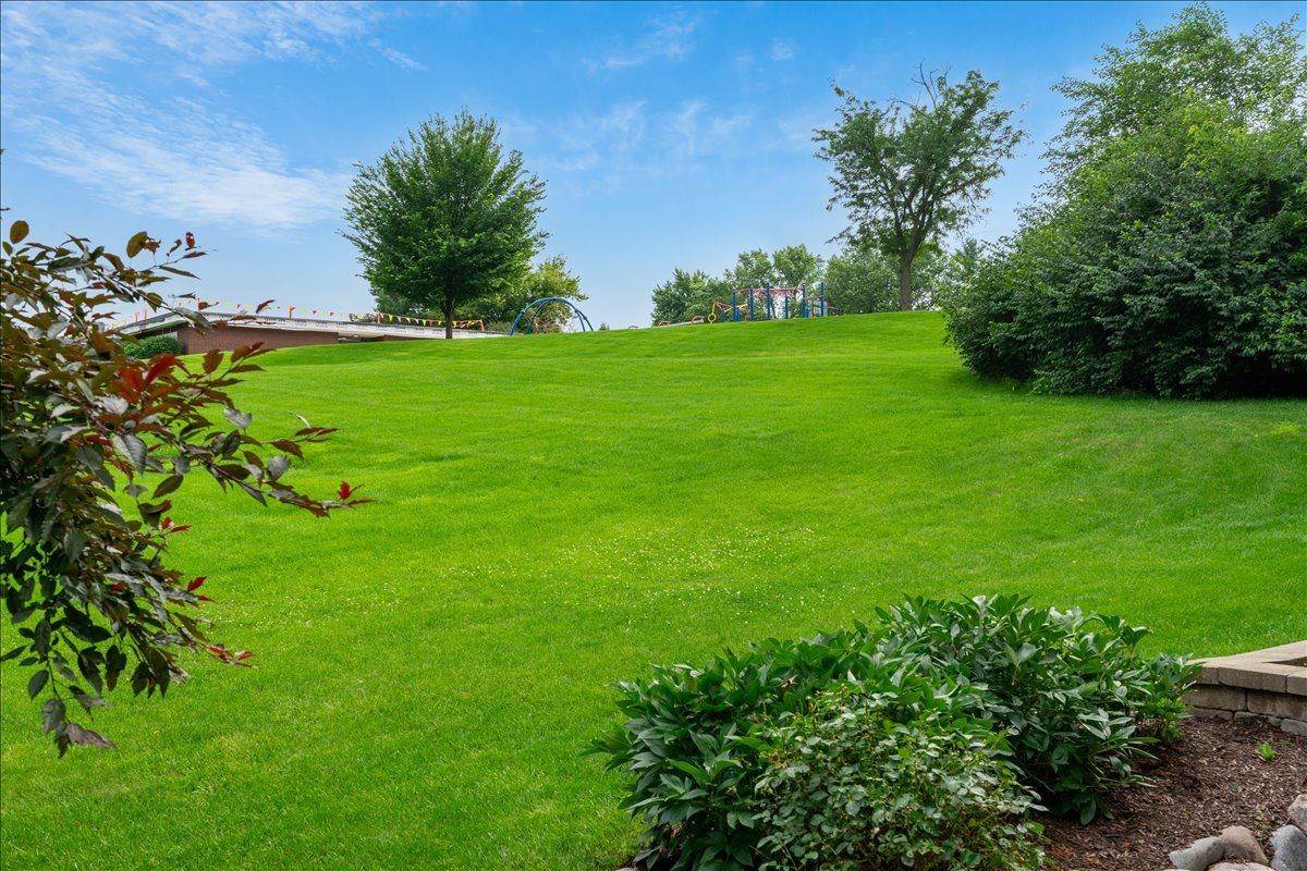 30 South Wulff Street Cary, IL 60013 - Photo 34 of 39 a backyard of a house with lots of green space and garden
