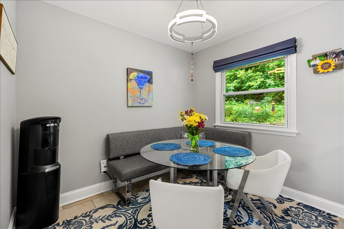 30 South Wulff Street Cary, IL 60013 - Photo 5 of 39 a view of a dining room with furniture a rug and wooden floor