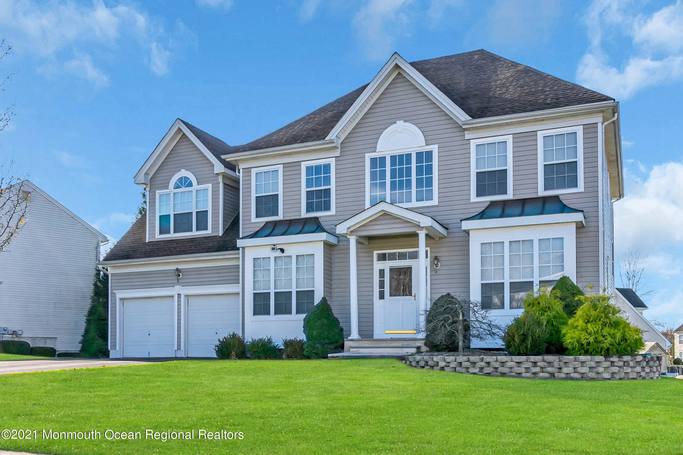 a front view of a house with a yard