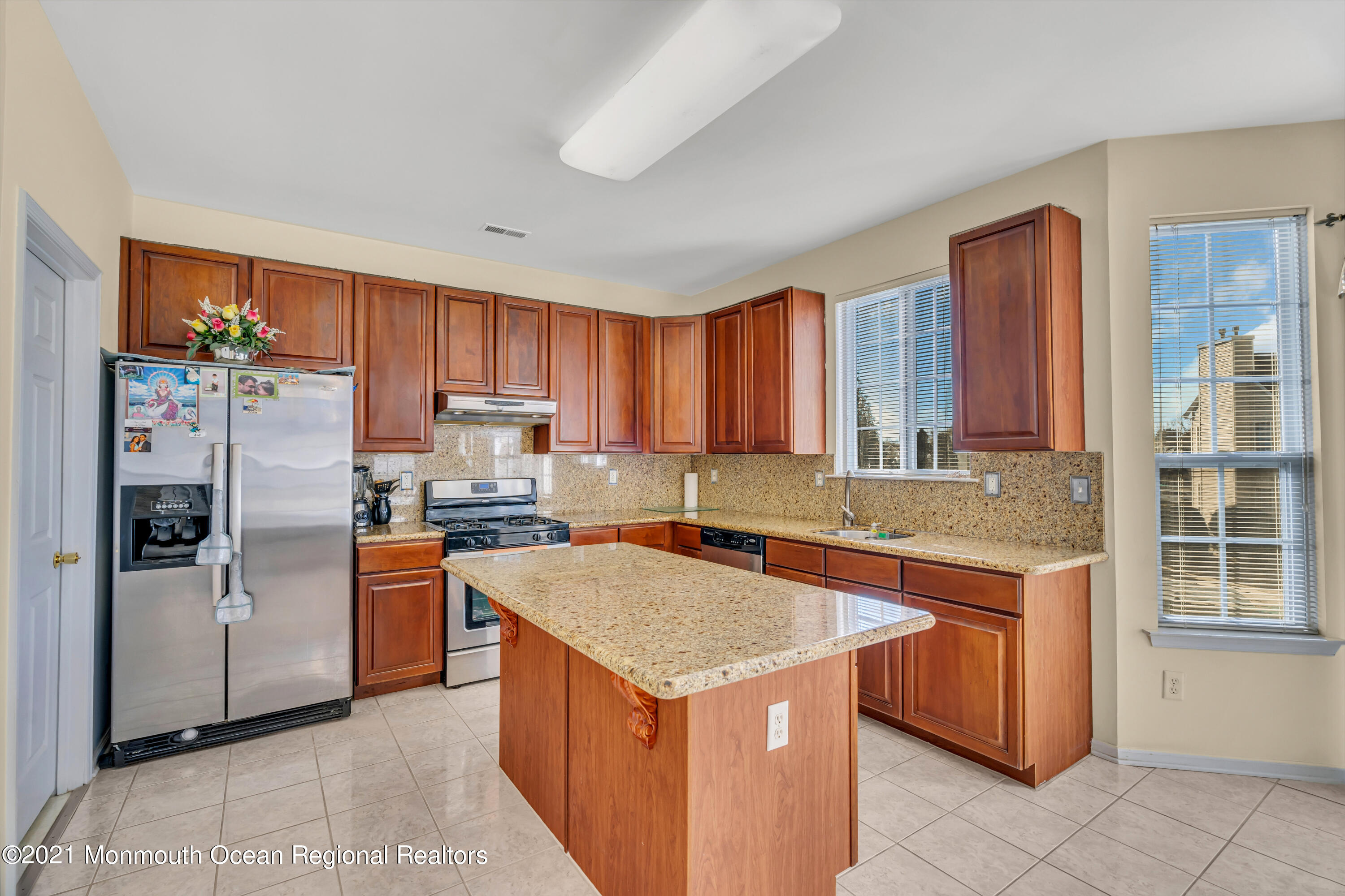 20 Lancaster Way Jackson, NJ 08527 - Photo 14 of 58 a kitchen with stainless steel appliances granite countertop a refrigerator stove and sink