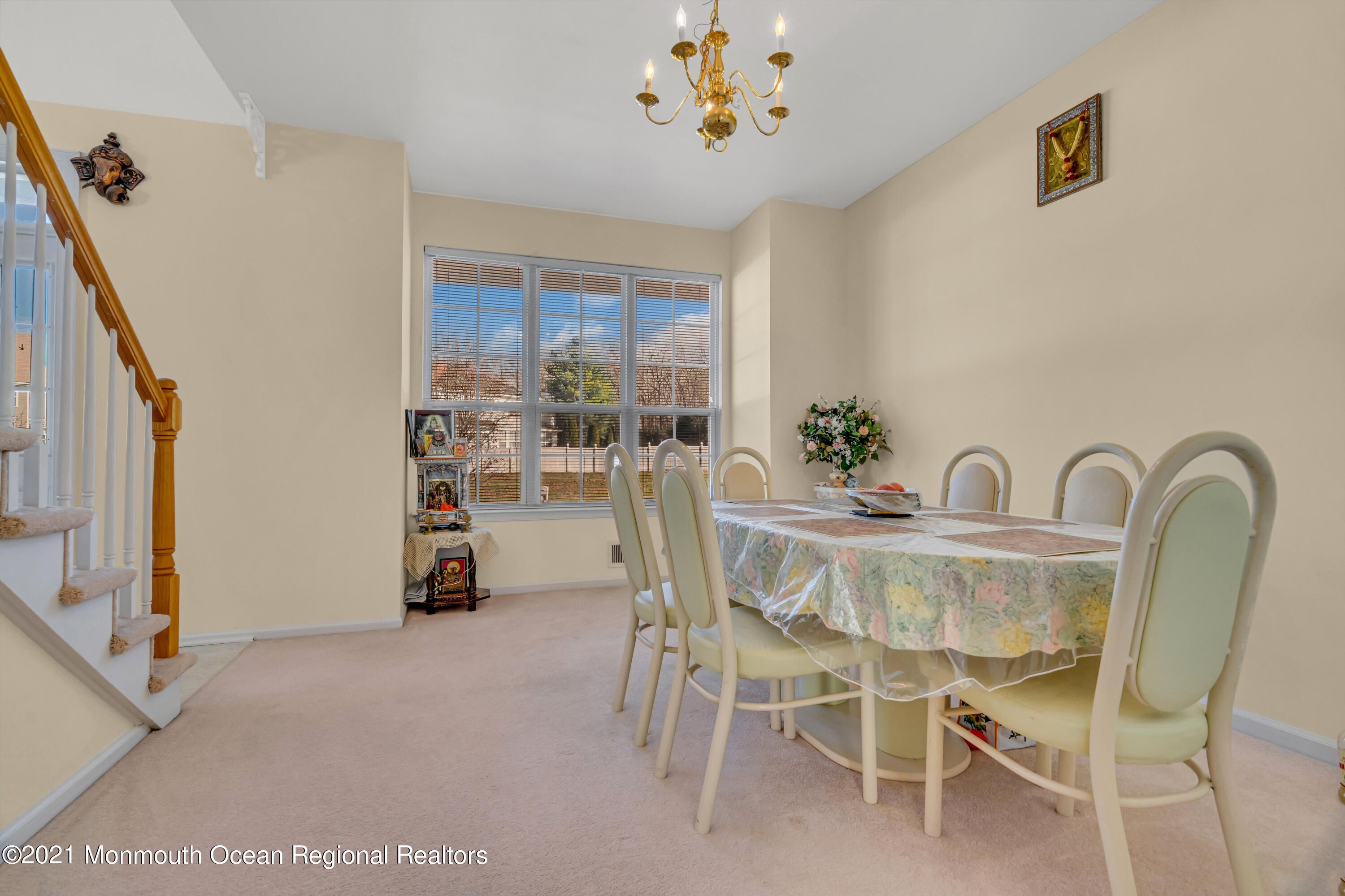 20 Lancaster Way Jackson, NJ 08527 - Photo 29 of 58 a dining room with furniture and a chandelier
