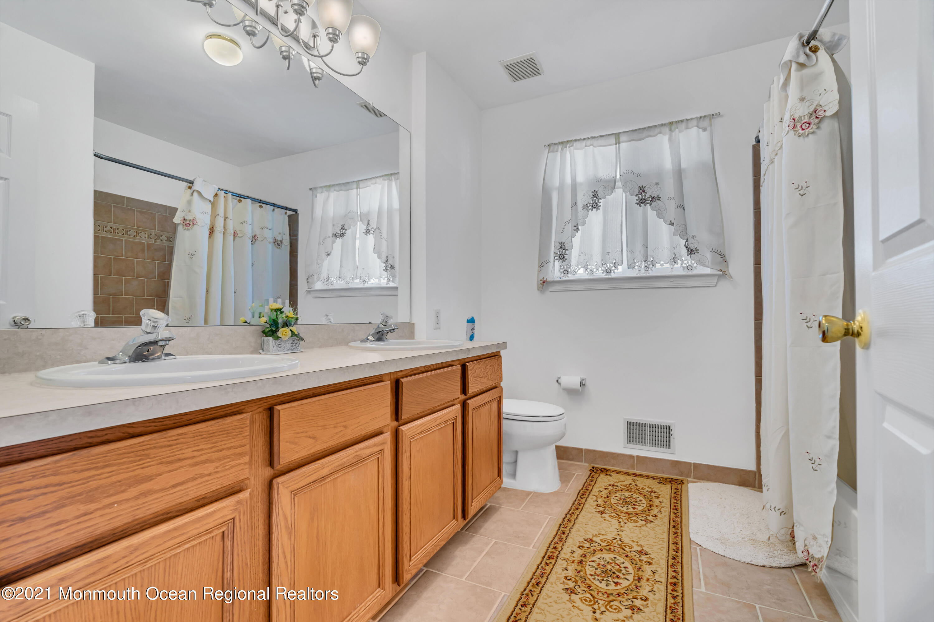 20 Lancaster Way Jackson, NJ 08527 - Photo 40 of 58 a spacious bathroom with double vanity sink a mirror and a shower