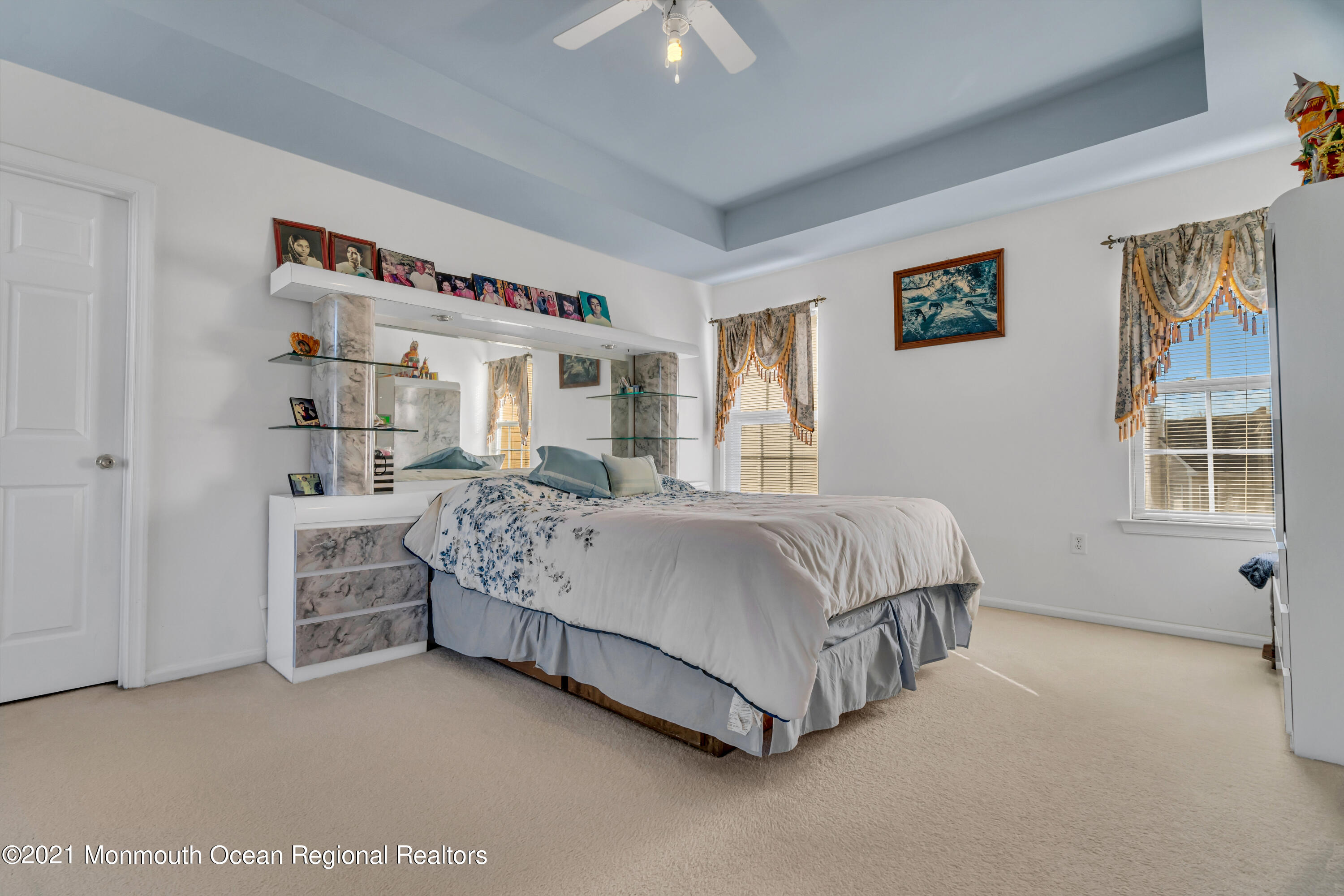 20 Lancaster Way Jackson, NJ 08527 - Photo 41 of 58 a bed sitting in a bedroom next to a window