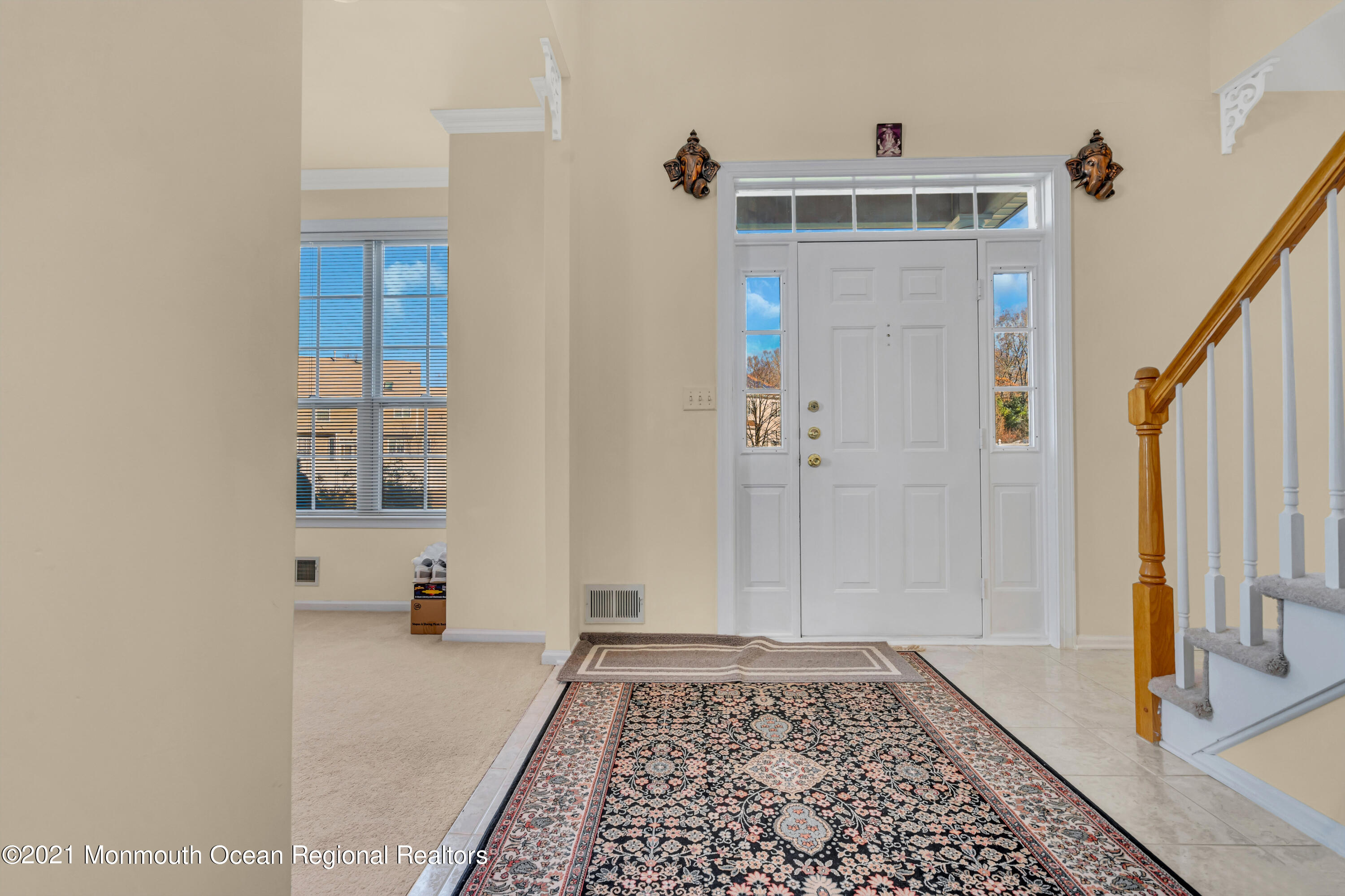 20 Lancaster Way Jackson, NJ 08527 - Photo 6 of 58 a view of a hallway with wooden floor and staircase