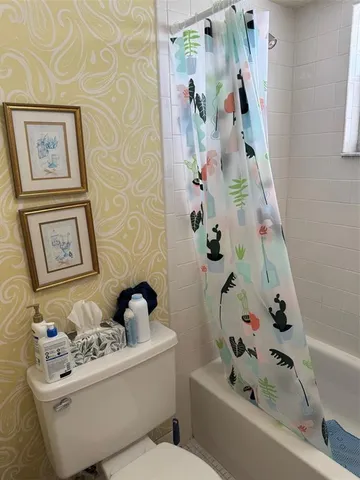 a bathroom with a bathtub and sink