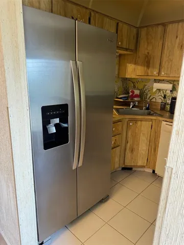 a kitchen with stainless steel appliances a refrigerator and a stove