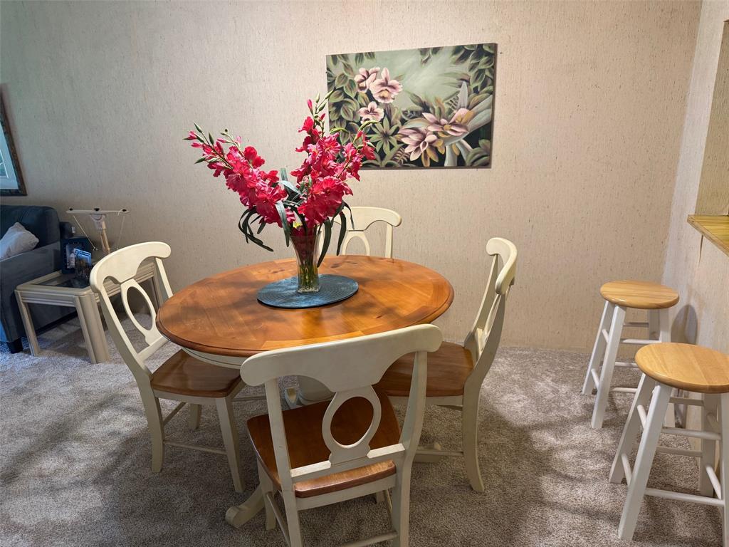 1801 Northwest 75th Avenue, Unit 306 Plantation, FL 33313 - Photo 8 of 27 a dining room with furniture and wooden floor