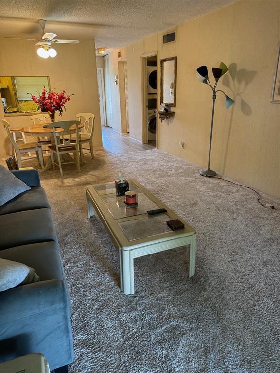1801 Northwest 75th Avenue, Unit 306 Plantation, FL 33313 - Photo 10 of 27 a living room with furniture and wooden floor