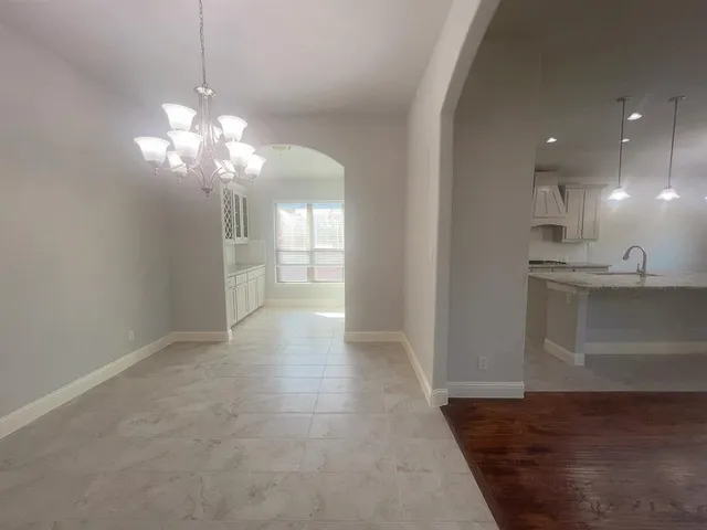 a view of a kitchen with a sink stainless steel appliances and cabinets
