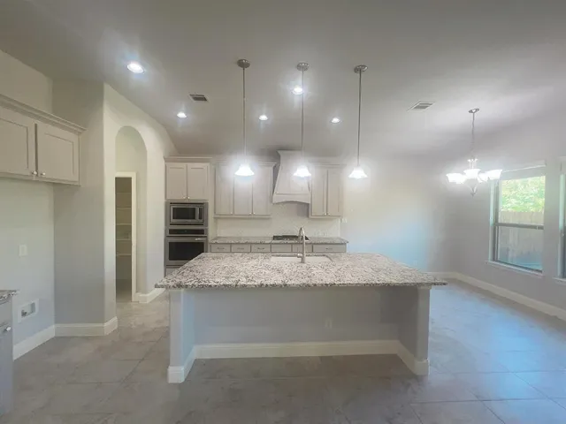 a view of kitchen and kitchen island