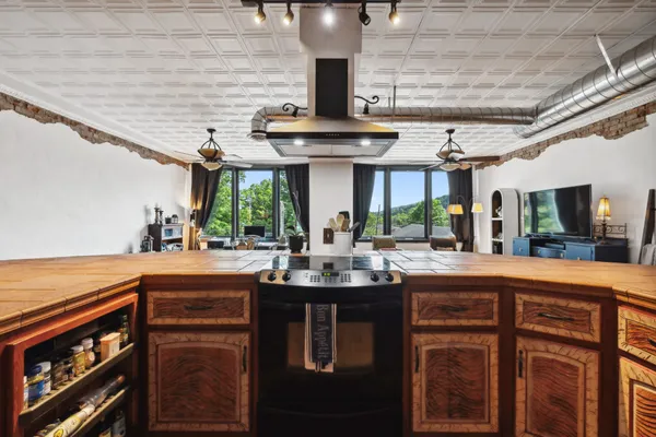 a kitchen with stainless steel appliances granite countertop a sink and cabinets