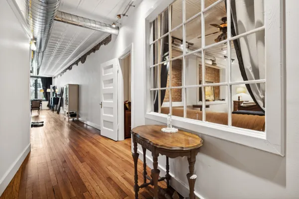 a view of a living room and a wooden floor