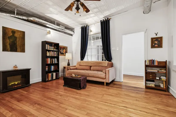 a living room with furniture and a fireplace