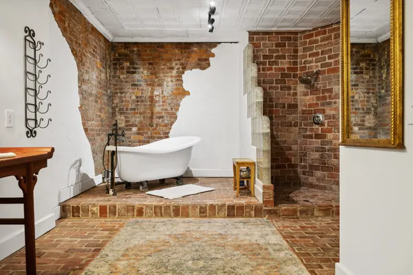 a bathroom with a toilet and shower