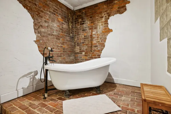a white toilet sitting next to a shower curtain