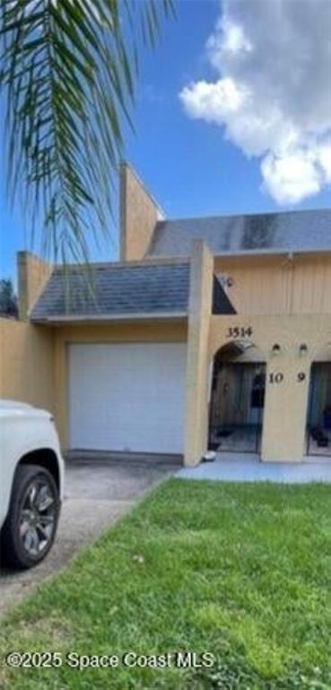 a view of a car parked in the yard