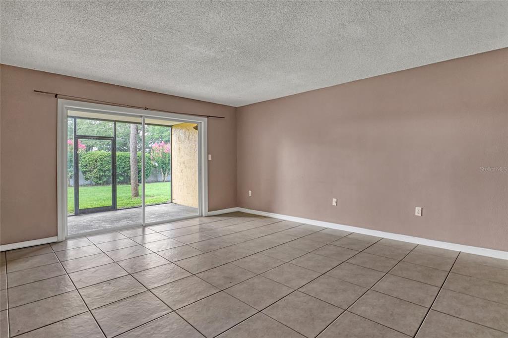3514 Dairy Road, Unit 10 Titusville, FL 32796 - Photo 11 of 44 a view of an empty room with a window