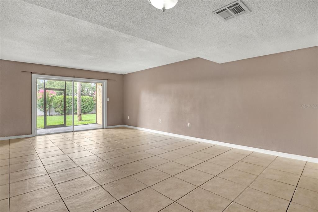 3514 Dairy Road, Unit 10 Titusville, FL 32796 - Photo 15 of 44 a view of an empty room with a window