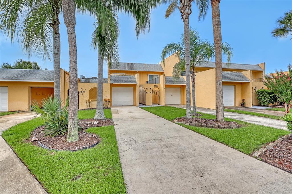 3514 Dairy Road, Unit 10 Titusville, FL 32796 - Photo 2 of 44 a front view of house with yard and green space