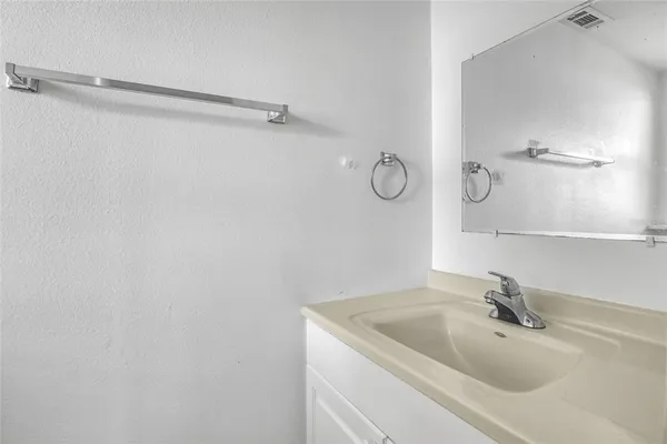 a white toilet sitting next to a window