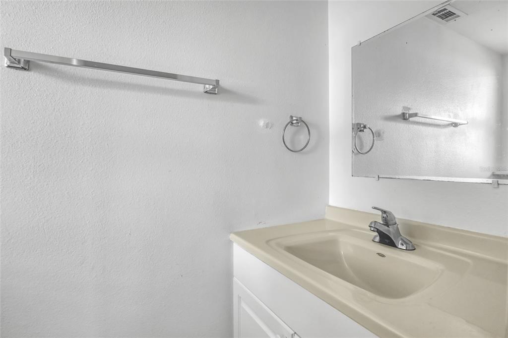 3514 Dairy Road, Unit 10 Titusville, FL 32796 - Photo 22 of 44 a bathroom with a sink and vanity