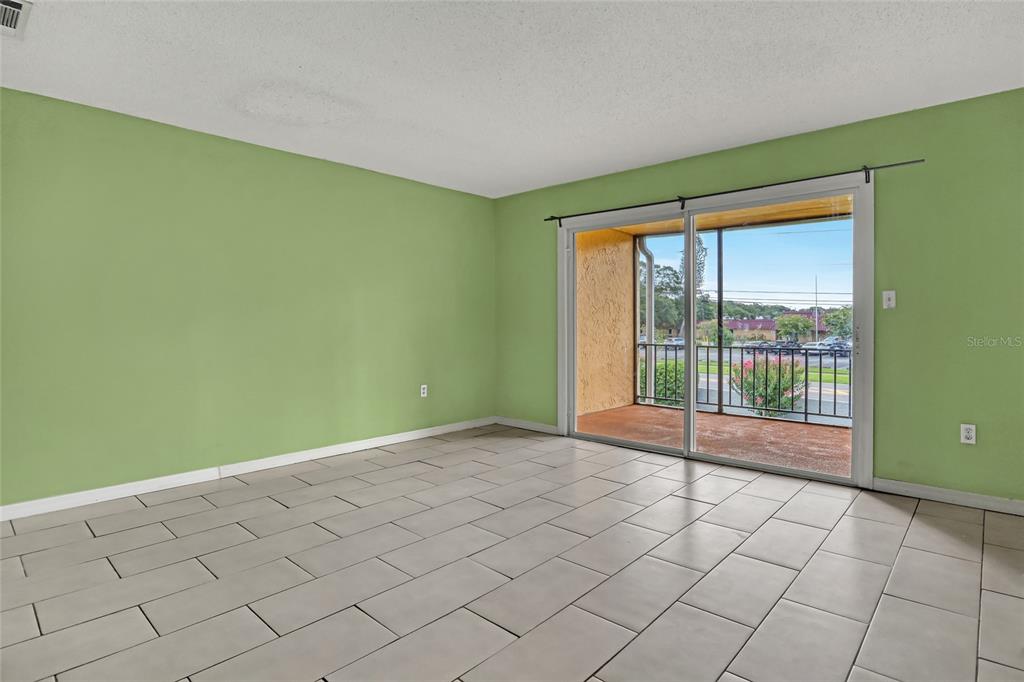 3514 Dairy Road, Unit 10 Titusville, FL 32796 - Photo 24 of 44 a view of an empty room with a window