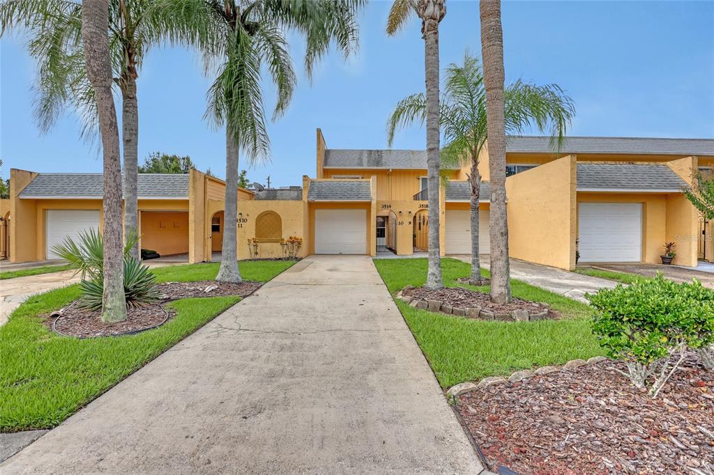 3514 Dairy Road, Unit 10 Titusville, FL 32796 - Photo 3 of 44 a front view of house with yard and green space