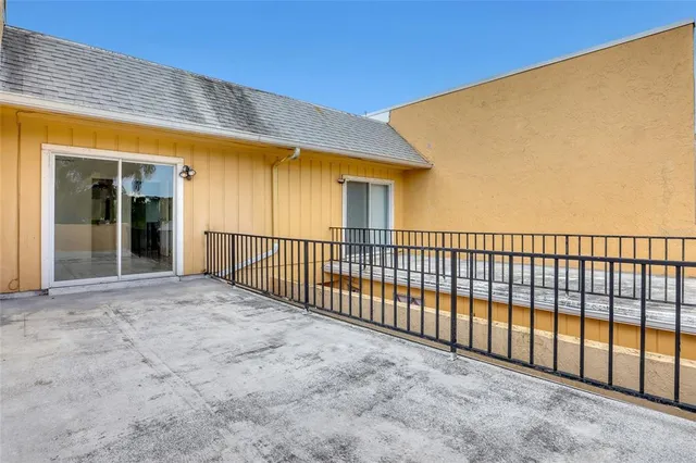 a view of a garden with a building in the background