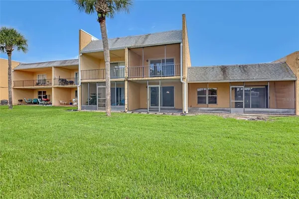 a view of a garden with a building in the background
