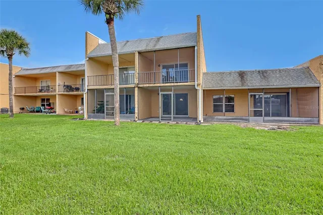 a view of a garden with a building in the background
