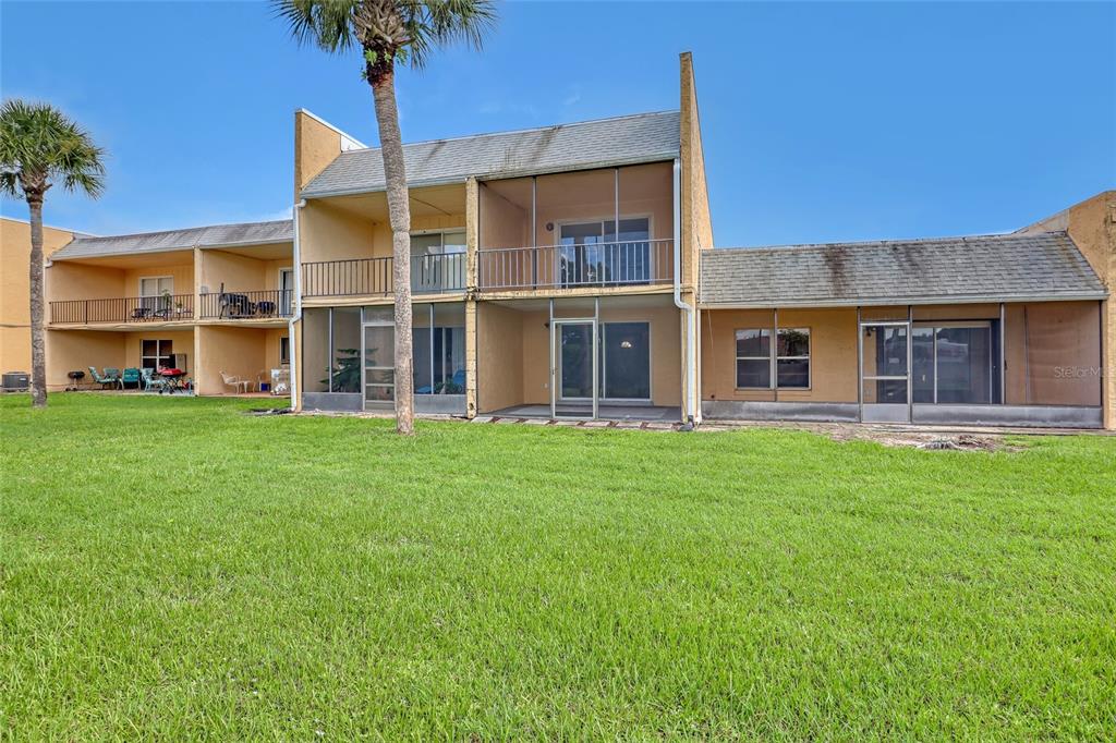 3514 Dairy Road, Unit 10 Titusville, FL 32796 - Photo 41 of 44 a front view of a house with a garden