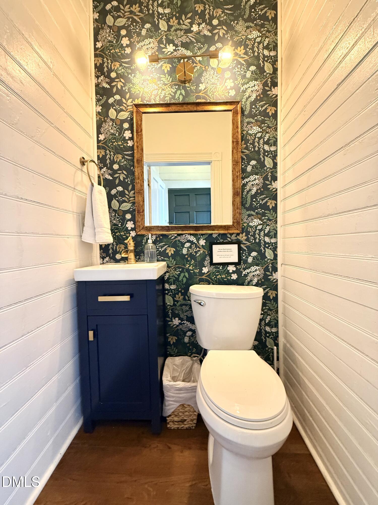 190 Broad Street Milton, NC 27305 - Photo 12 of 62 a bathroom with a toilet a sink and mirror