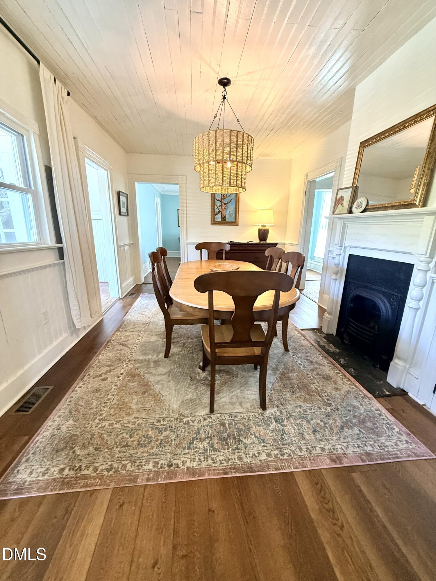 190 Broad Street Milton, NC 27305 - Photo 15 of 62 a view of a livingroom with furniture window and wooden floor