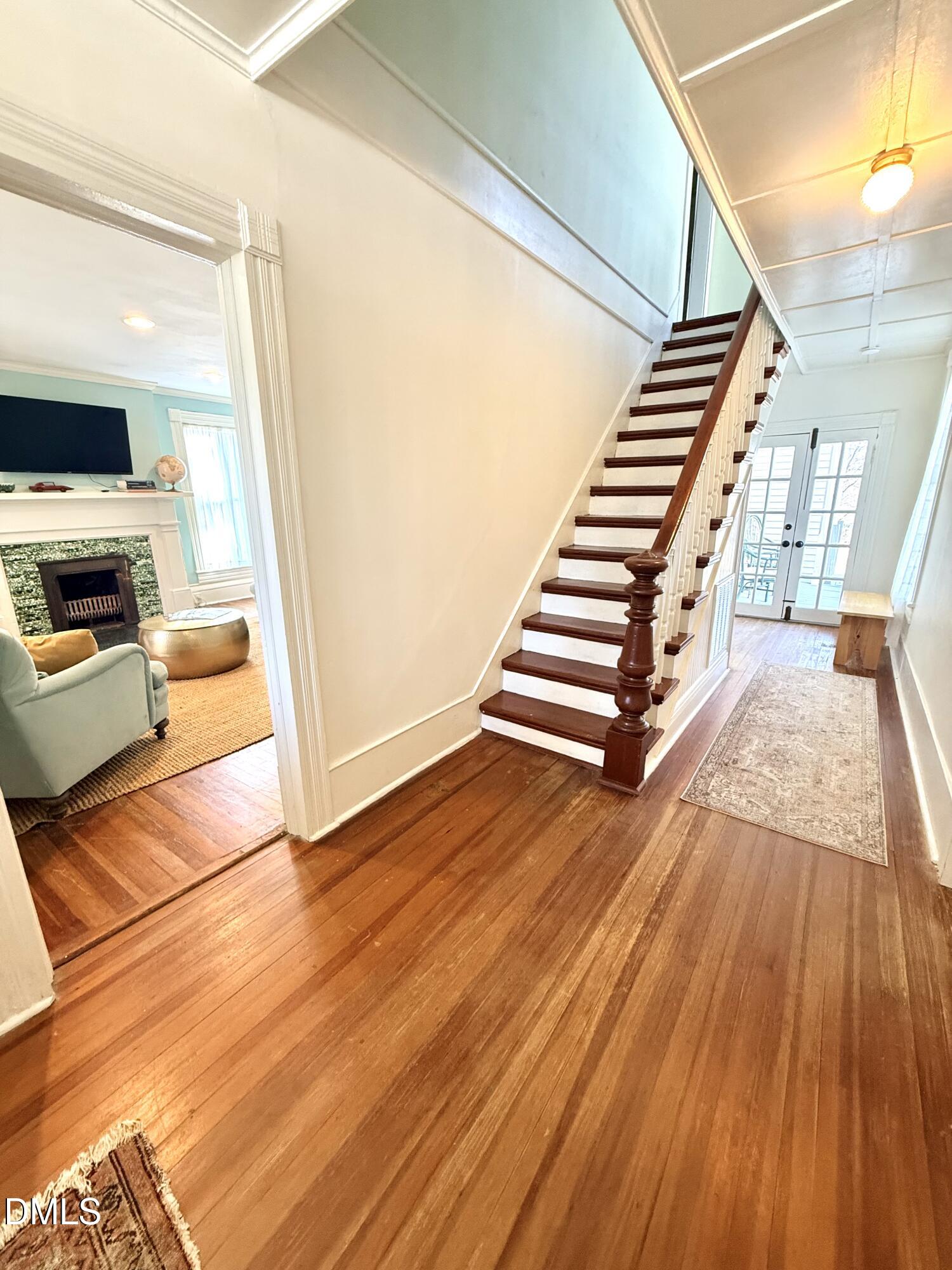 190 Broad Street Milton, NC 27305 - Photo 2 of 62 a view of a kitchen with wooden floor and stairs