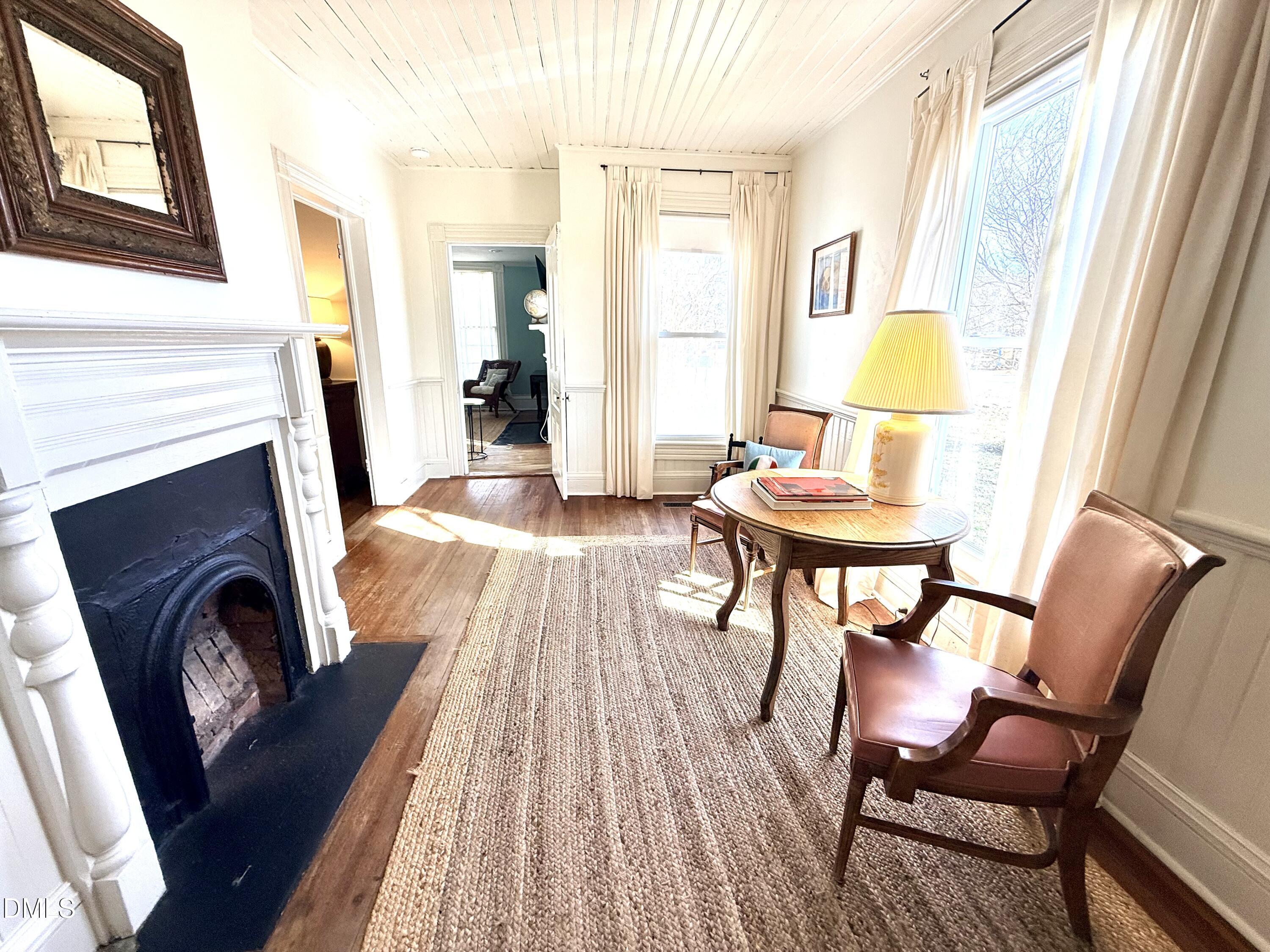 190 Broad Street Milton, NC 27305 - Photo 21 of 62 a living room with furniture and a fireplace